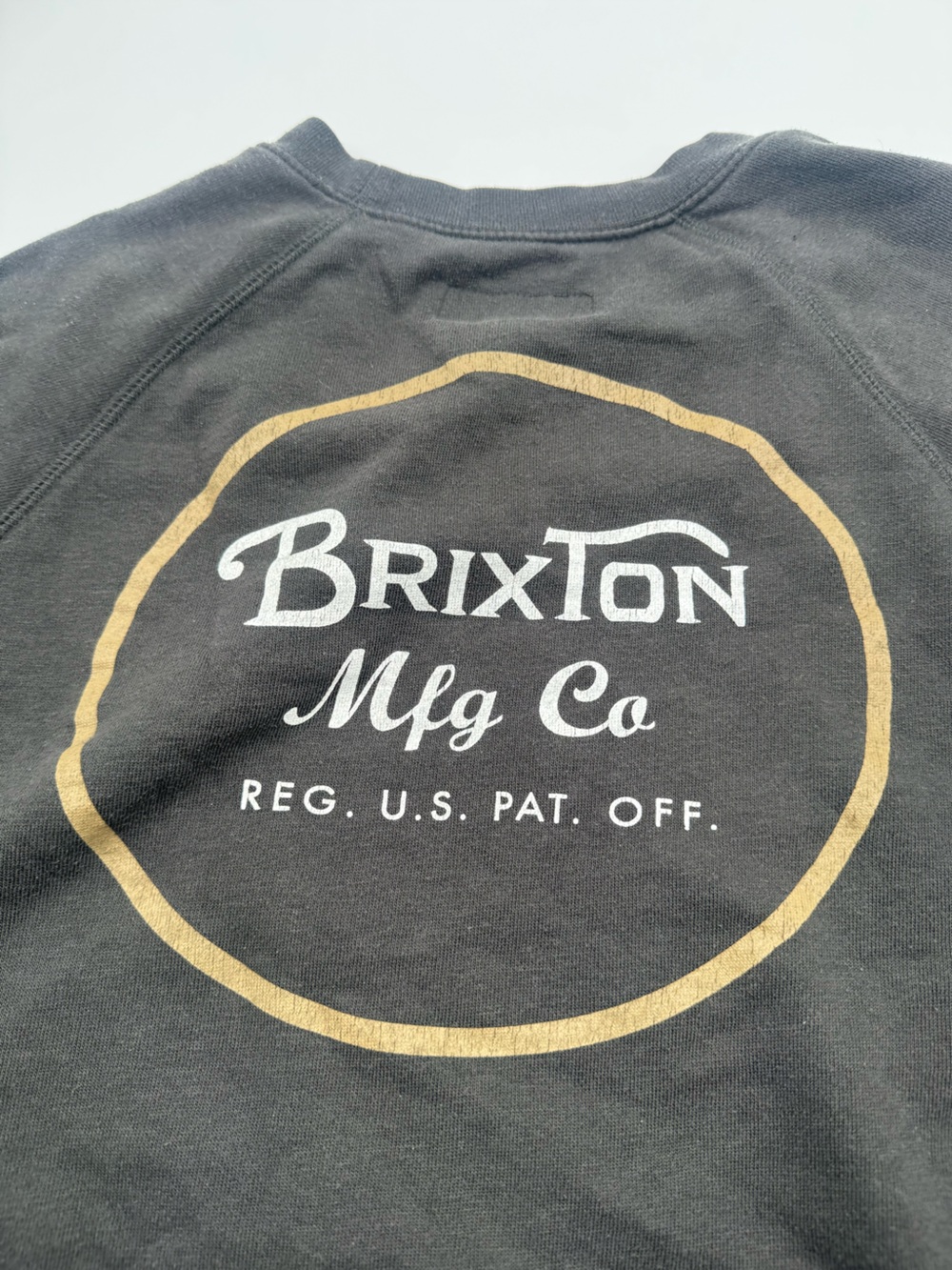 Brixton Black Sweatshirt with Gold Ring and White Logo